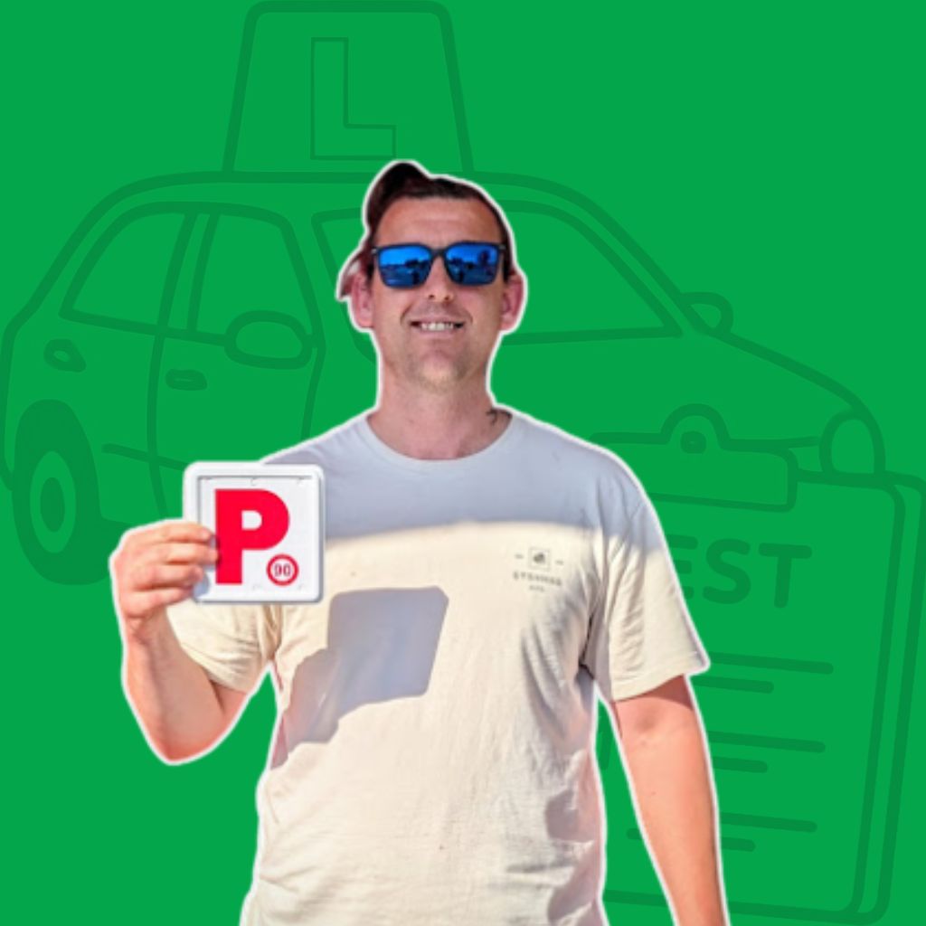 a guy smiling and holding a card